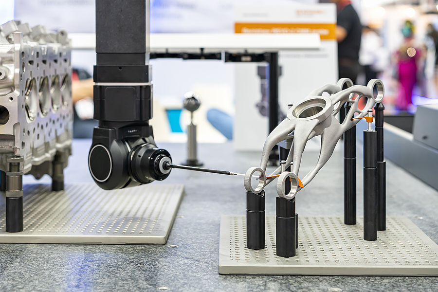 automatic coordinate measurement machine (CMM) during inspection automotive or motorcycle industrial part in quality control manufacturing process