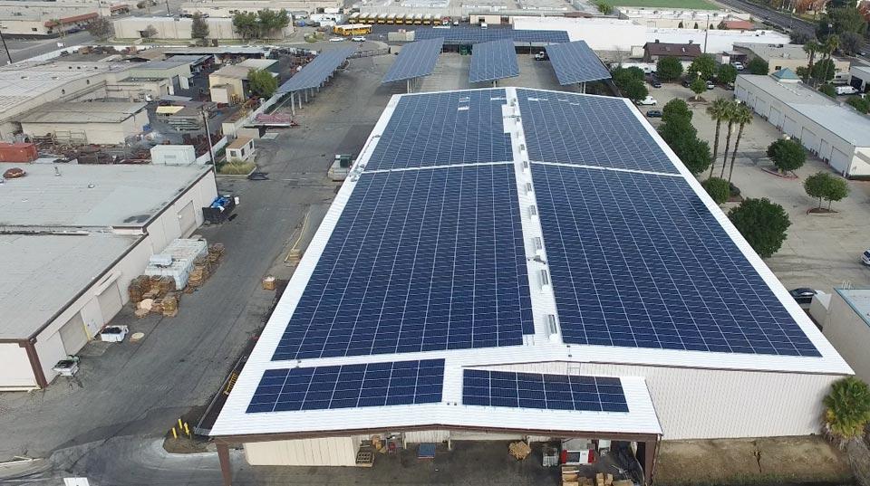 manufacturing facility powered by solar energy installation in sustainable industry context